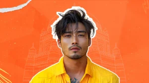 A confident male influencer in a yellow shirt representing engagement strategies for modern brands with cultural architecture in the background