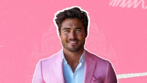 A smiling male influencer in a pink suit symbolizing storytelling techniques for influencer marketing to build connection and drive conversion