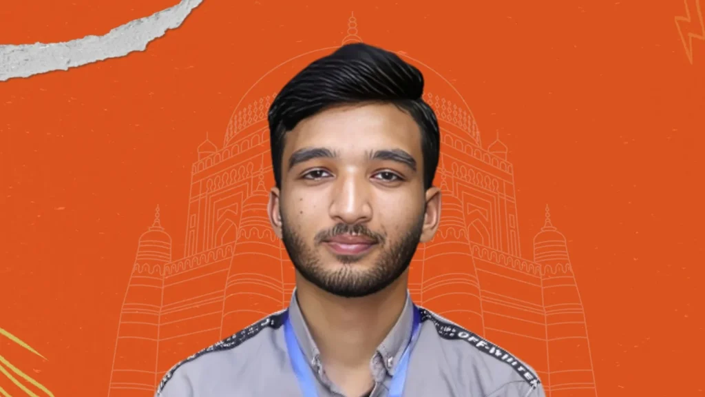 Mujhe young professional with styled hair and orange heritage Multan backdrop