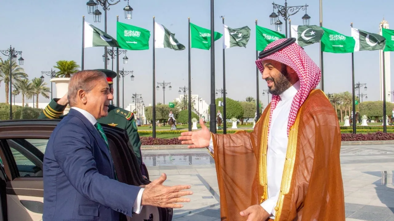 Prime Minister Shehbaz Sharif shakes hands with Saudi Crown Prince Mohammed bin Salman during defence pact signing
