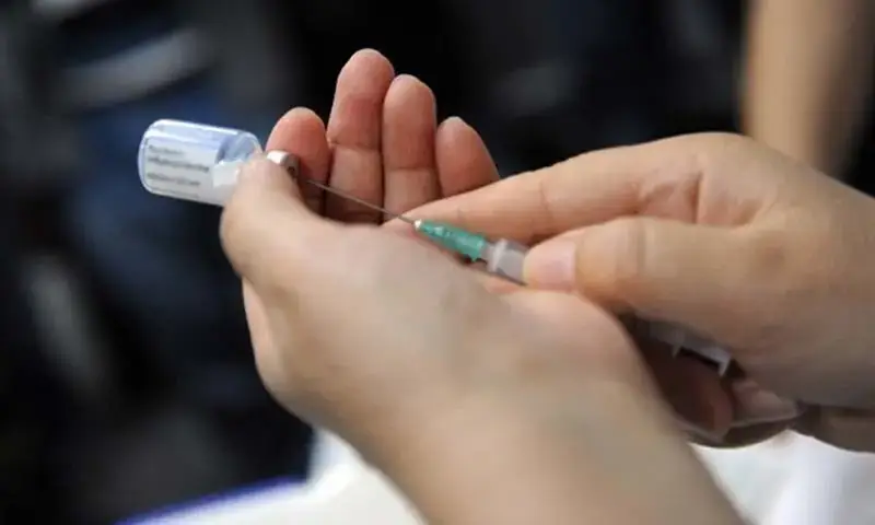 HPV vaccination in Punjab showing syringe and vial for immunization