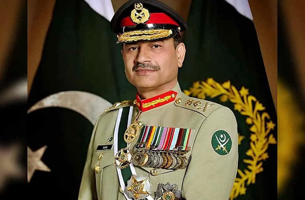 Field Marshal Asim Munir in military uniform with Pakistan flag background