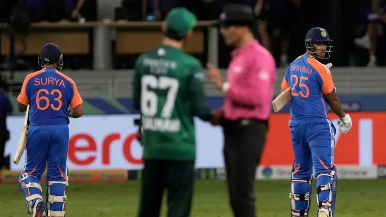 Pakistan and India cricket players with referee in no-handshake controversy