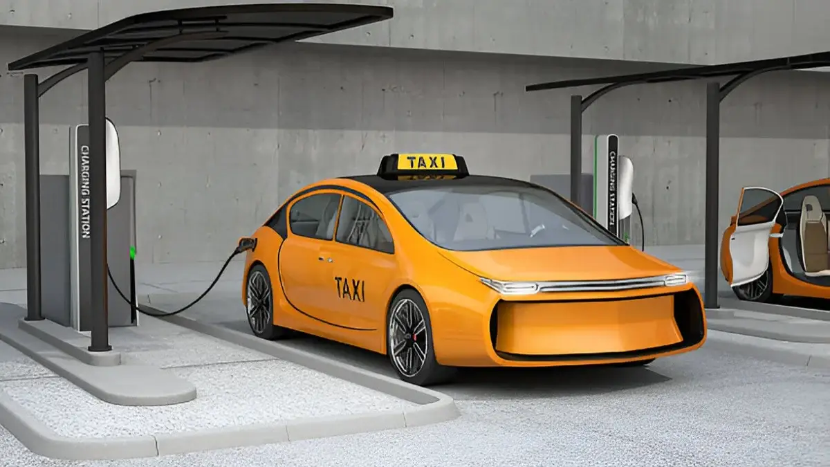Yellow electric taxi charging at a station, representing Punjab’s new e-taxi scheme to introduce 1,100 electric taxis under Transport Vision 2030.
