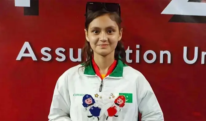 Pakistani Taekwondo champion Ayesha Ayaz posing after winning gold and silver medals in Indonesia.