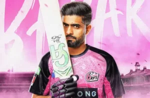 Babar Azam in Sydney Sixers pink jersey holding a cricket bat ahead of his BBL debut fan zone launch