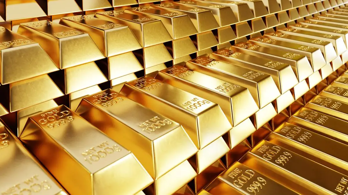 Stacked gold bars representing record gold price surge in Pakistan to Rs. 425,178 per tola.