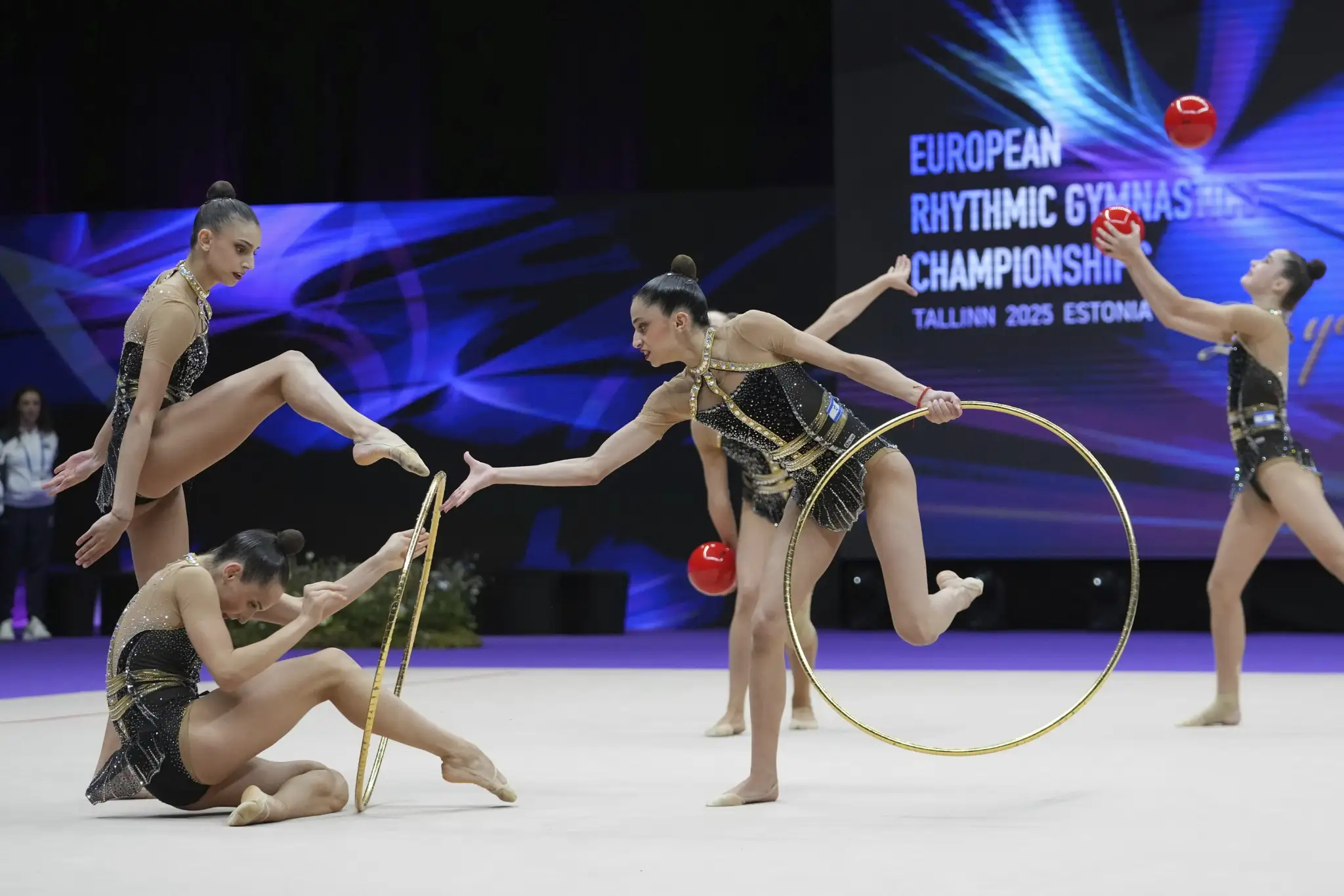 Rhythmic gymnasts performing with hoops during the World Championship, representing the Indonesia Israeli Gymnasts Visa controversy