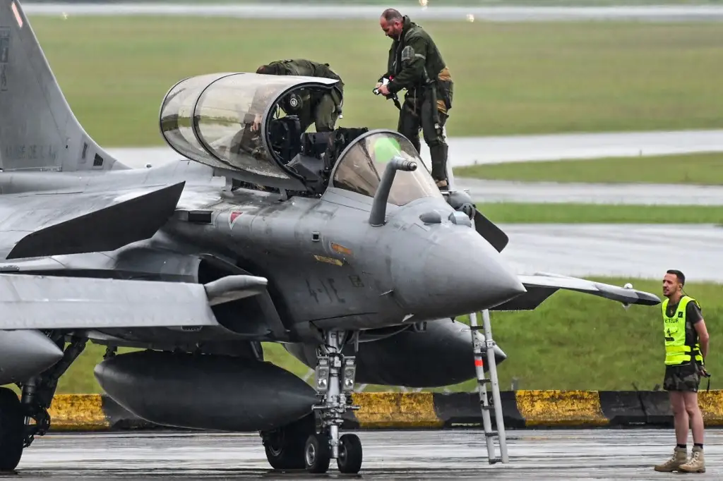 Indonesian Air Force personnel inspecting fighter jet after signing $9 billion J-10C deal with China