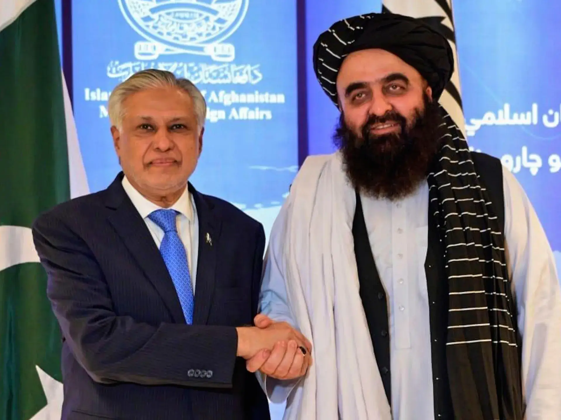 Pakistan and Afghanistan officials shaking hands after the Doha Agreement, symbolizing regional peace and cooperation