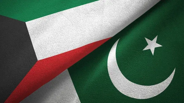 Close-up view of Pakistan and Kuwait national flags symbolizing diplomatic relations and cooperation