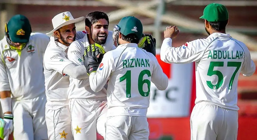 Image of Pakistan cricket team celebrating during a Test match, representing the likely playing XI for the first Test against South Africa.