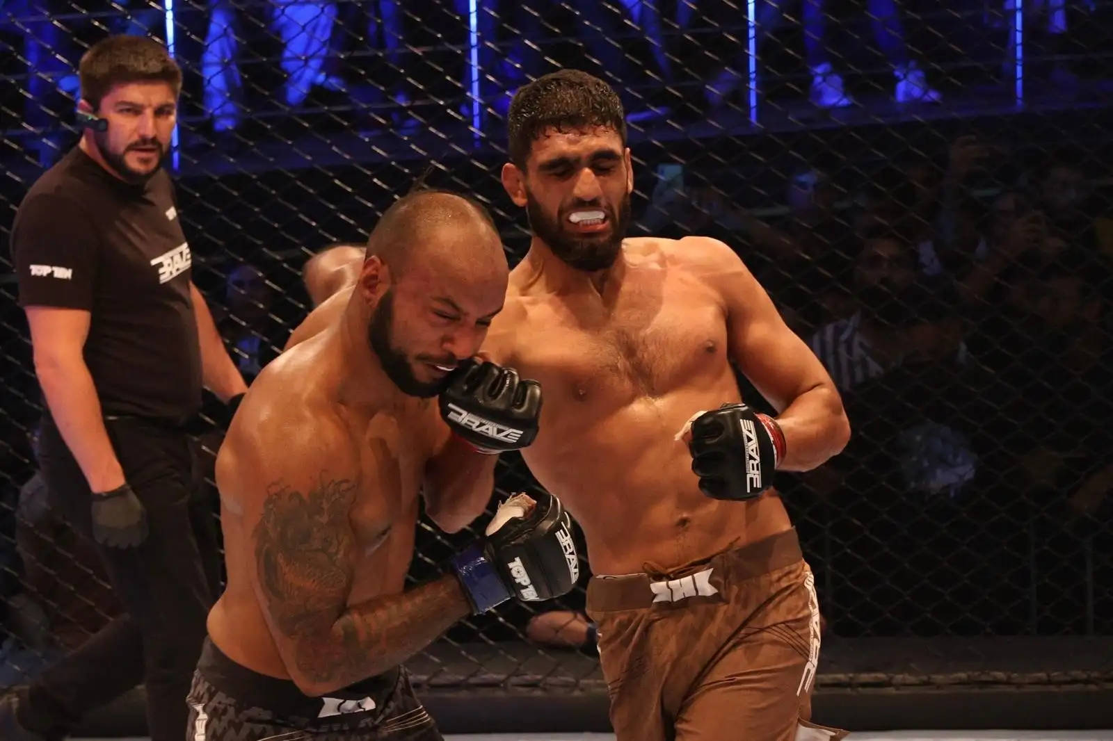 Pakistani MMA fighter Rizwan Ali competing in the cage during an intense match, representing his dominance in MMA against India