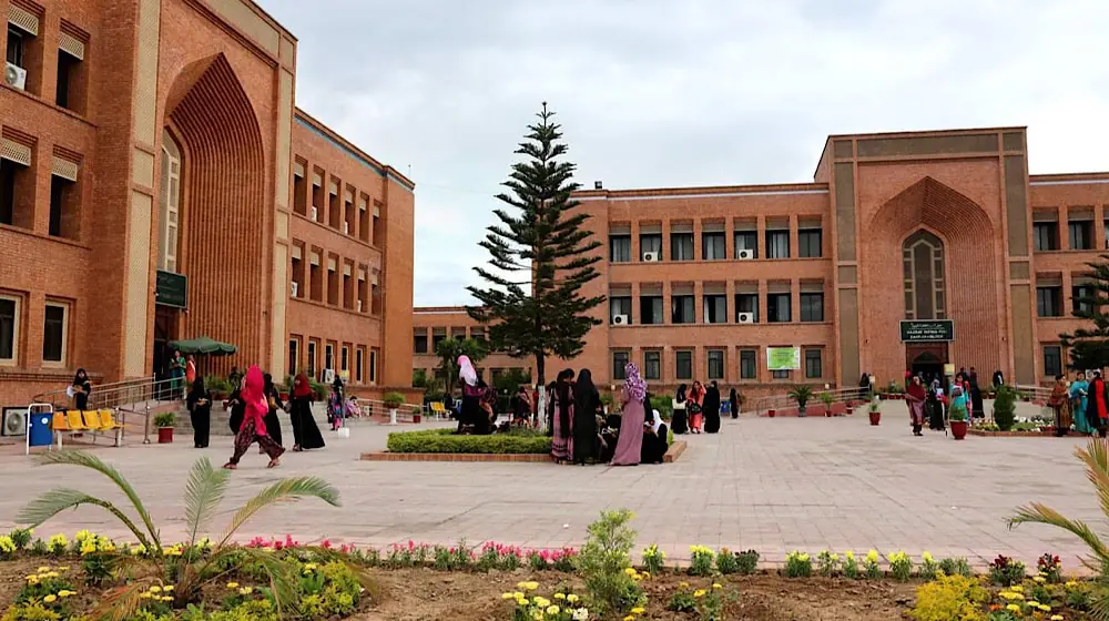 Students walking outside a university campus in Punjab, Pakistan, as international universities plan to open new campuses