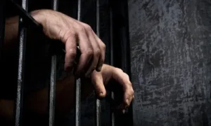 Scene showing prison bars, representing the relatives held in connection with the death of an 18-year-old girl found dead in DHA Karachi.