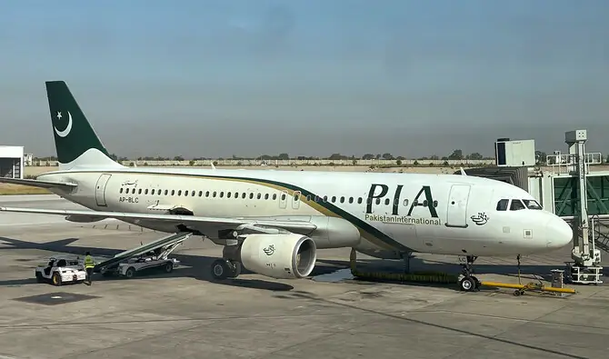 Pakistan International Airlines (PIA) aircraft at the airport, symbolizing Air Punjab’s upcoming launch