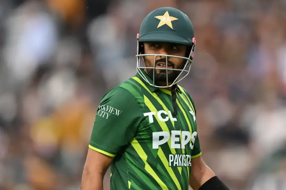 Pakistan batter Babar Azam walking on the field during a T20 match, representing Babar Azam Ducks record update