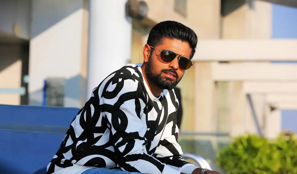 Babar Azam, Pakistan’s star batter, posing in sunglasses, symbolizing his leadership in the cricket field