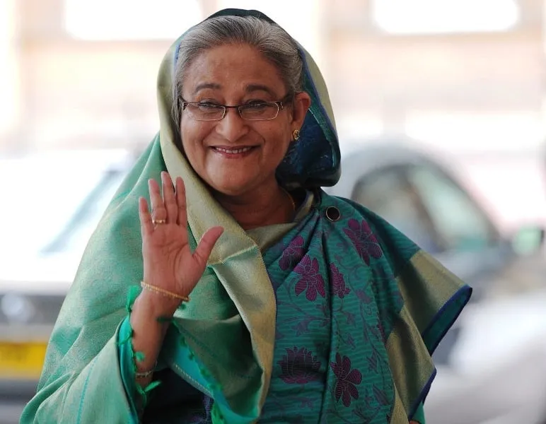 Former Bangladesh Prime Minister Hasina smiling and waving during a public appearance