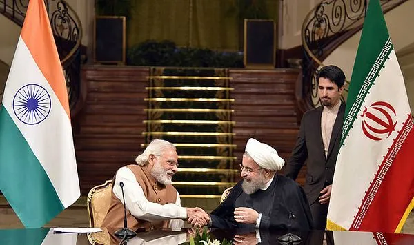 Indian and Iranian leaders shaking hands during a diplomatic meeting, representing the Iran Visa-Free Suspension