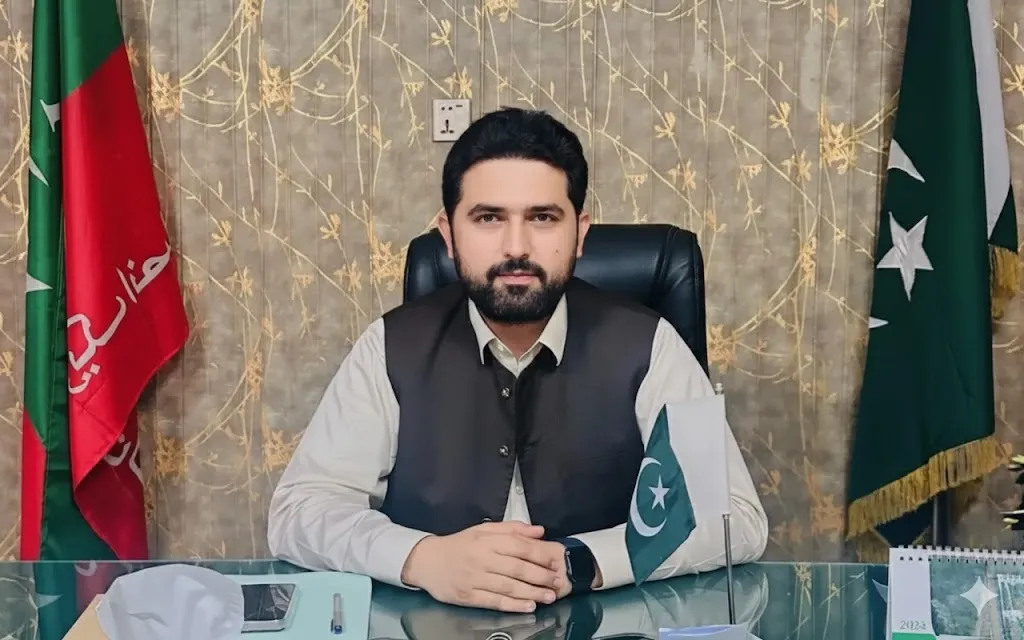 Khyber Pakhtunkhwa Chief Minister Sohail Afridi seated in his office, representing the shift to an interest-free government investment system.