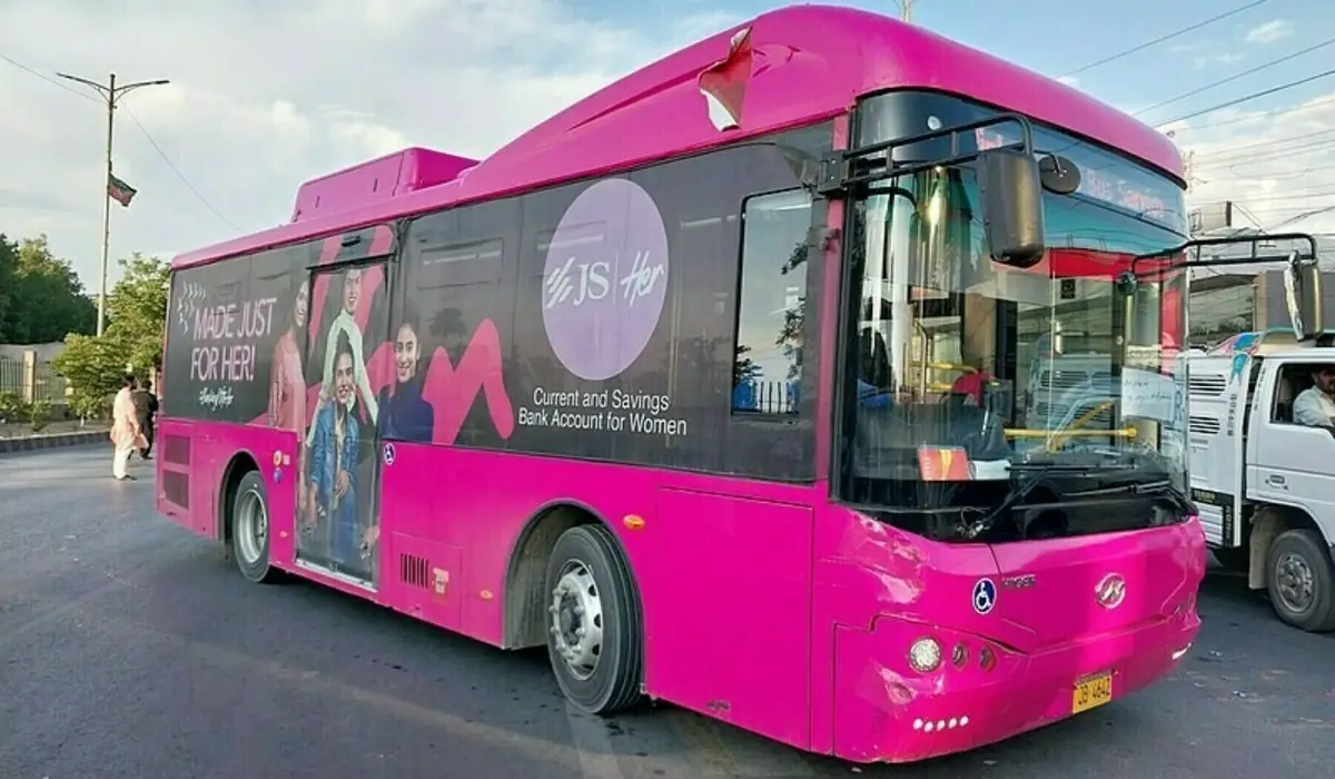 Pink Bus Karachi driving on the road as part of the women-only transport service launched on the new Abdullah Chowk to Numaish route.
