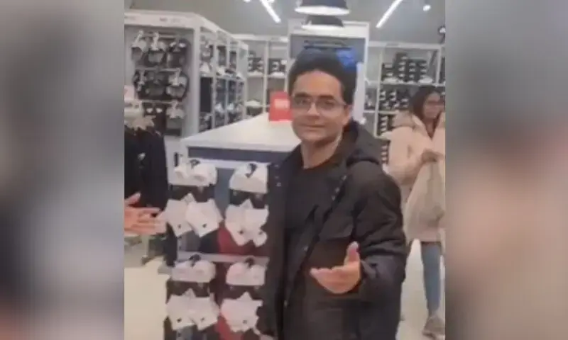 Shahzeb Khanzada being confronted inside a clothing store during a harassment incident that sparked political and media outrage.