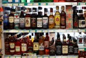 Alcohol bottles displayed on shelves representing Alcohol Sales Saudi Arabia policy update