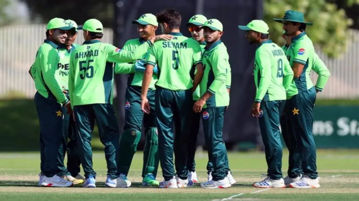 Pakistan cricket team players gather on field during international cricket match