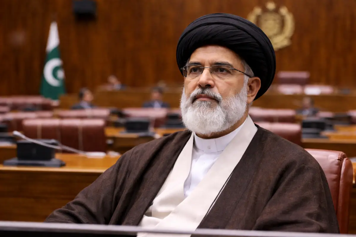 A religious leader wearing a black turban attends a session of the Pakistan Senate inside the parliament building