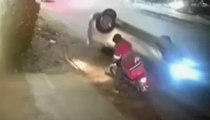 CCTV footage showing DHA accident involving speeding car hitting delivery rider in Karachi