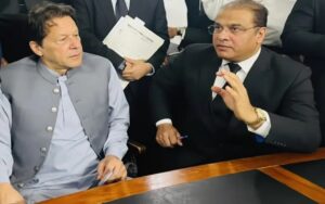 Imran Khan sitting with lawyer Salman Safdar during legal consultation meeting