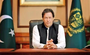 Imran Khan seated at his desk as Imran Khan sisters criticise PTI leadership