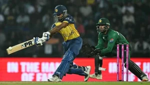 Sri Lankan batter playing a shot during Pakistan vs Sri Lanka T20 World Cup match while Pakistan wicketkeeper watches