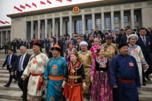 Ethnic minority representatives in traditional clothing outside the Great Hall of the People in Beijing as China promotes Mandarin through new ethnic law