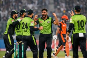 Lahore Qalandars players celebrate Haris Rauf’s wicket against Hyderabad Kingsmen during PSL 11 opener at Gaddafi Stadium