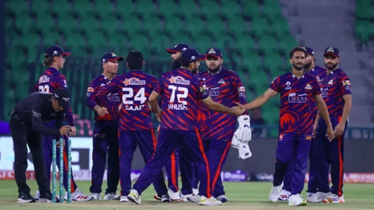 Karachi Kings celebrate their win over Quetta Gladiators during PSL 11, showcasing team camaraderie on the field.