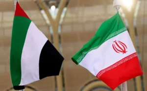 UAE and Iran national flags displayed during diplomatic discussions highlighting UAE Iran tensions