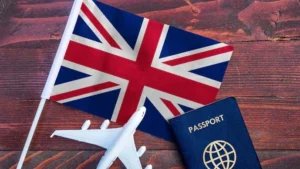 UK flag with passport and airplane model symbolizing UK visa ban and new immigration policy restrictions