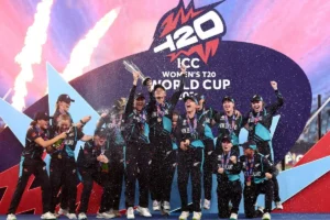 Womens T20 World Cup champions celebrating victory with trophy and confetti on stage