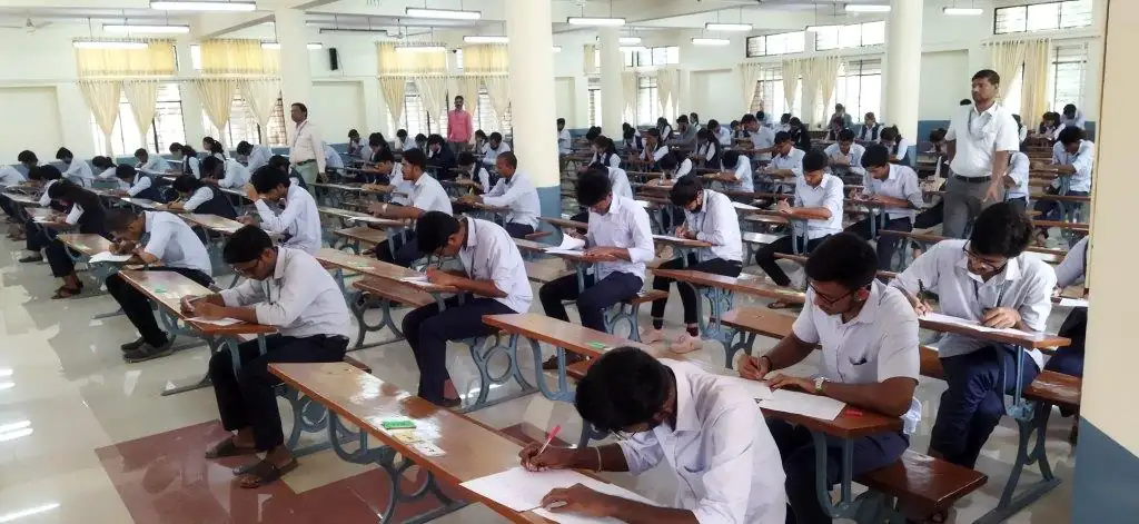 Students appearing in Karachi exams inside examination hall under strict conditions