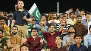 PSL 11 fans cheering in stadium with Pakistan flag during match crowd atmosphere