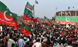 Large PTI rally crowd with flags representing PTI rally delay decision ahead of US Iran dialogue in Islamabad