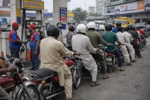 Motorcyclists waiting at petrol pump in Karachi for Sindh petrol subsidy amid rising fuel prices