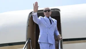 US Iran talks context showing Prime Minister Shehbaz Sharif waving before diplomatic visit