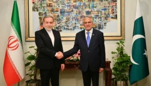 Pakistan Deputy PM Ishaq Dar and Iran FM Abbas Araghchi discussing regional peace and the Strait of Hormuz situation.