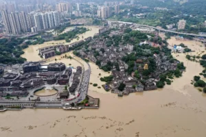 Flood damaged bridge and muddy floodwaters in China Floods after heavy rainfal