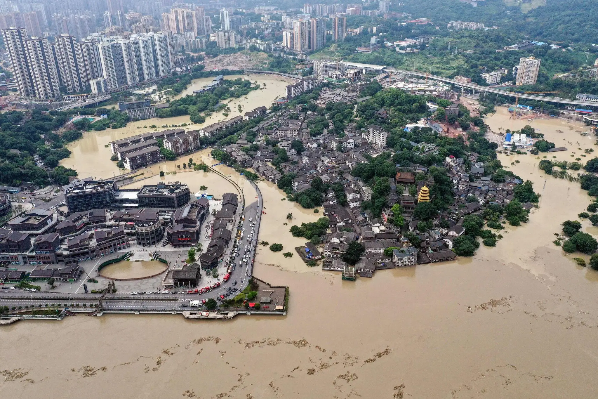 Flood damaged bridge and muddy floodwaters in China Floods after heavy rainfal