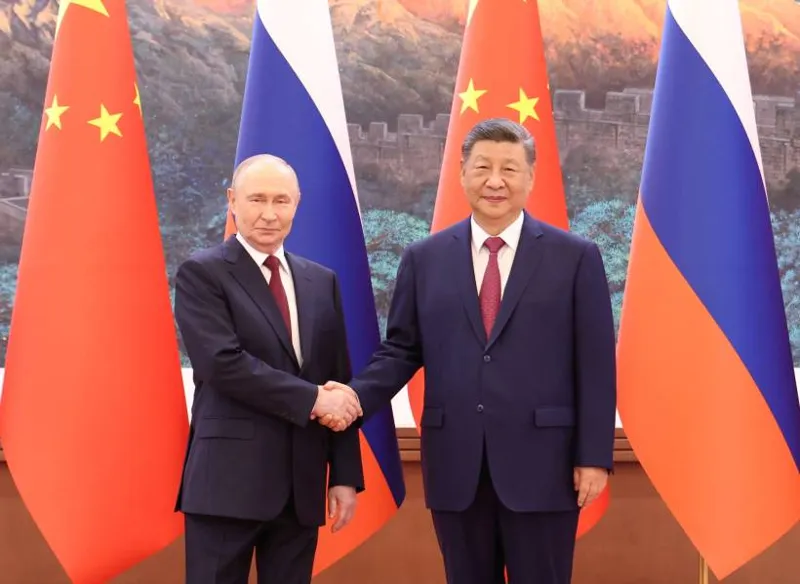 Chinese President Xi Jinping and Russian President Vladimir Putin shaking hands during official talks in Beijing about China Russia ties