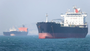 Cargo vessels and tankers in the Strait of Hormuz during the Project Freedom pause announcement.